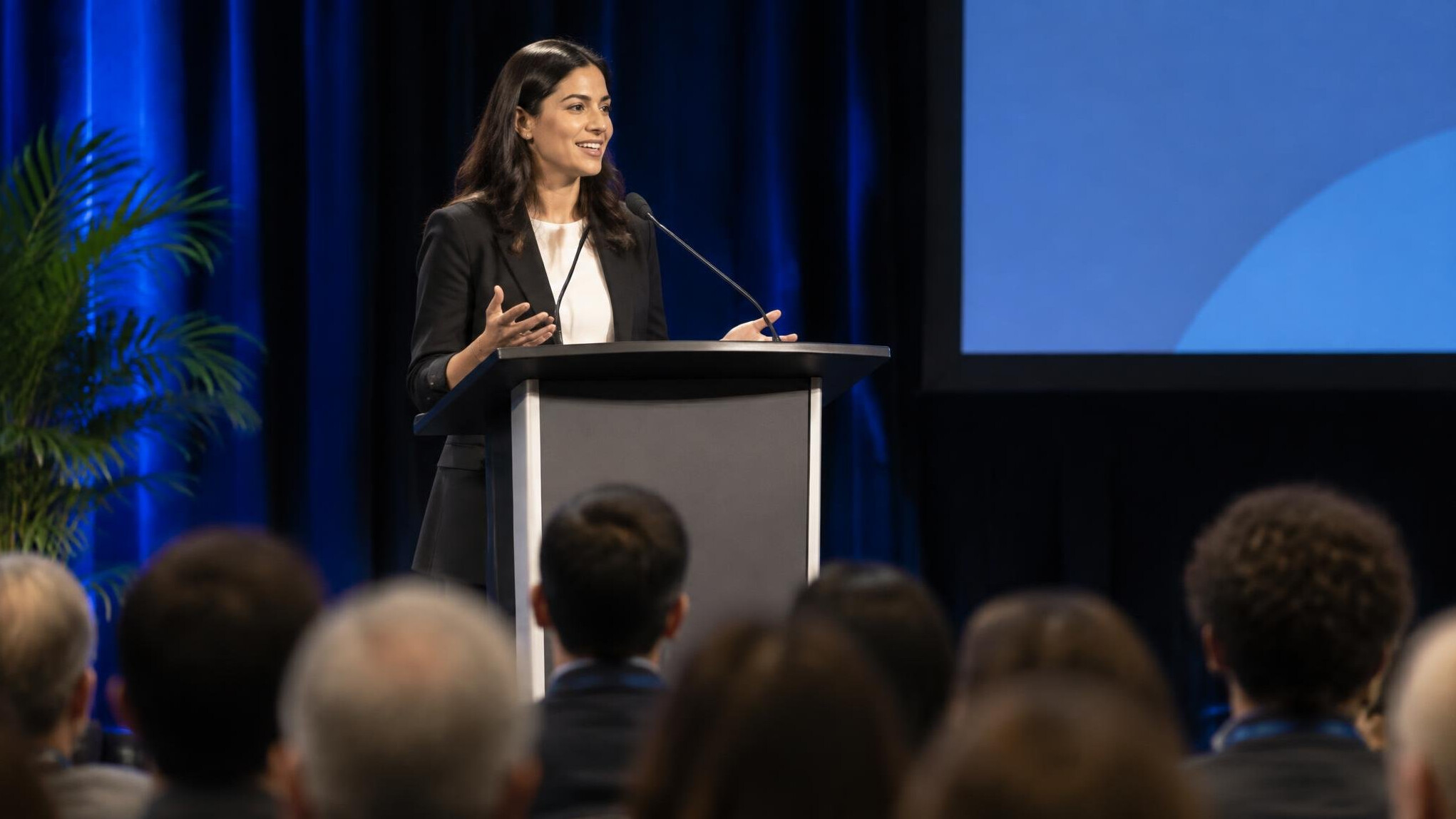 person giving speech on stage